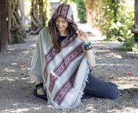 Thumbnail for A poncho with hood for men and women worn for retreats, meditation or fun.